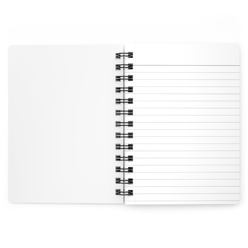 Open view of spiral bound journal displaying the lines on the paper