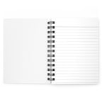 Open view of spiral bound journal displaying the lines on the paper