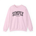 Front view of Light Pink crewneck sweatshirt with black large ‘SIMPLY BLESSED’ text across chest
