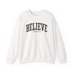 Front view of White crewneck sweatshirt with black large BELIEVE text and John 14:1 below it across chest