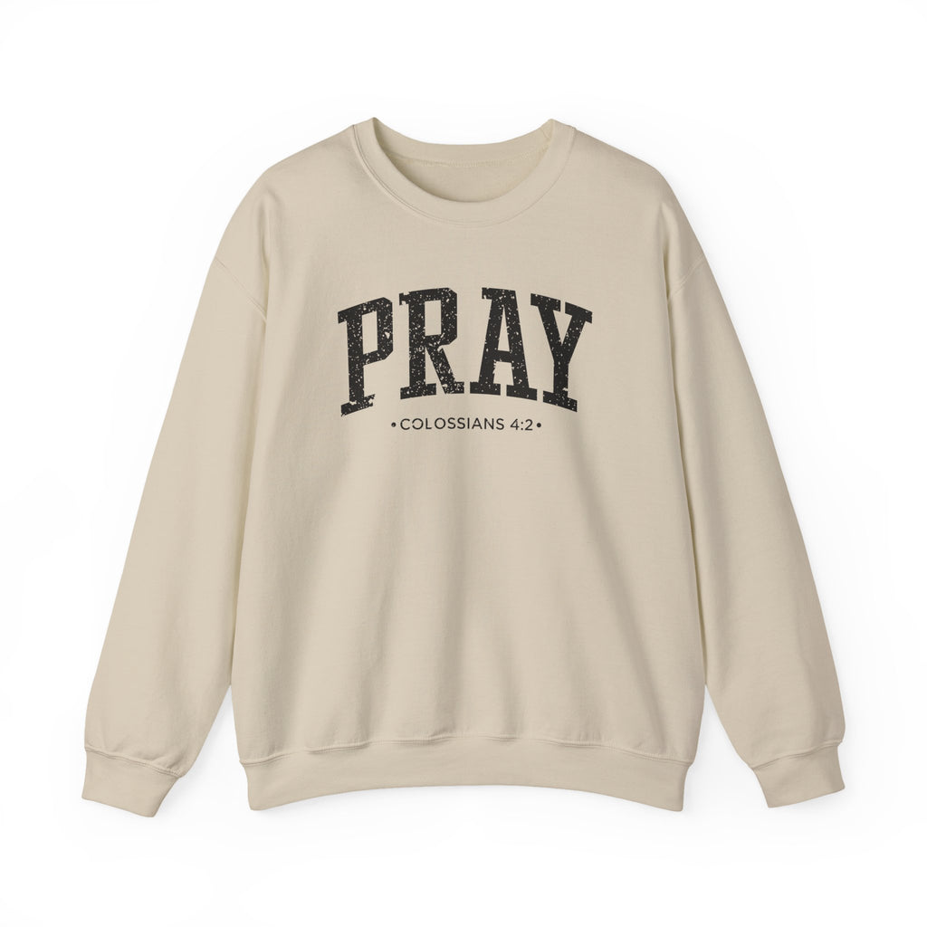 Front view of Sand crewneck sweatshirt with black large PRAY text and Colossians 4:2 below it across chest