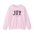 Front view of Light Pink crewneck sweatshirt with black large JOY text and John 16:22 below it across chest