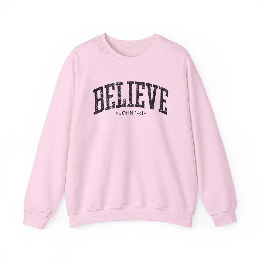 Front view of Light Pink crewneck sweatshirt with black large BELIEVE text and John 14:1 below it across chest
