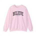 Front view of Light Pink crewneck sweatshirt with black large BELIEVE text and John 14:1 below it across chest