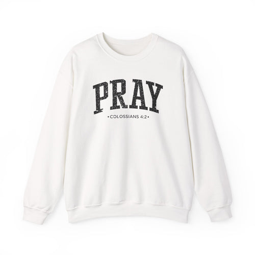 Front view of White crewneck sweatshirt with black large PRAY text and Colossians 4:2 below it across chest