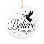 Front view of White ceramic Christmas ornament with graphic displaying stars, an angel, and text that says Believe