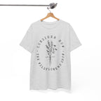 Front view Ash t-shirt with large black floral graphic and Luke 12:27 Bible verse displayed on a hanger