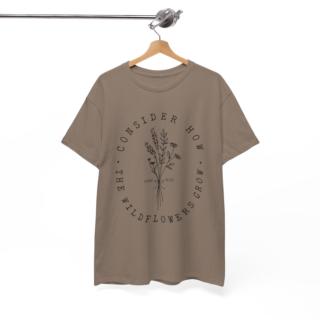 Front view Brown Savana t-shirt with large black floral graphic and Luke 12:27 Bible verse displayed on a hanger