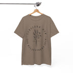 Front view Brown Savana t-shirt with large black floral graphic and Luke 12:27 Bible verse displayed on a hanger