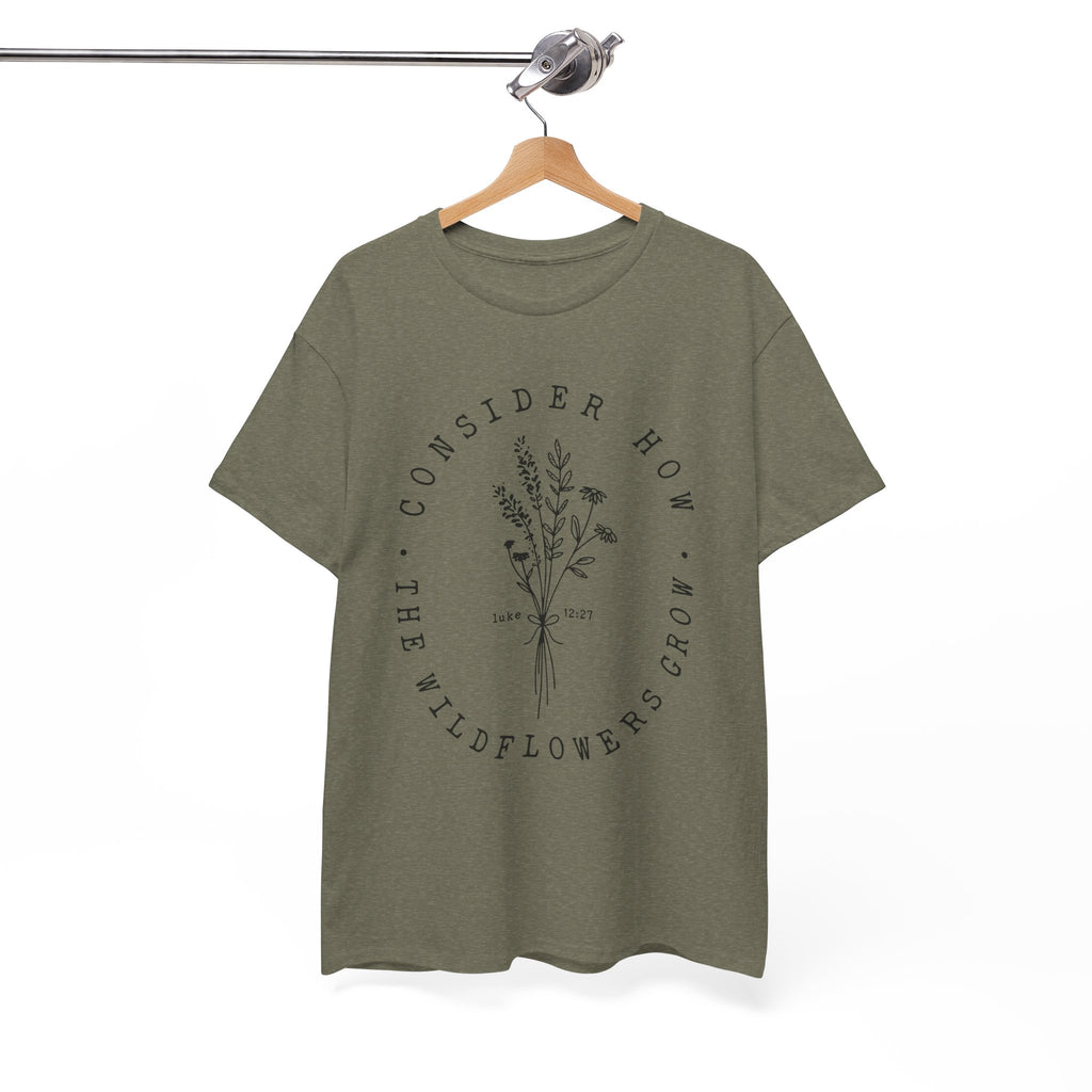 Front view Heather Military Green t-shirt with large black floral graphic and Luke 12:27 Bible verse displayed on a hanger