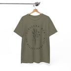 Front view Heather Military Green t-shirt with large black floral graphic and Luke 12:27 Bible verse displayed on a hanger
