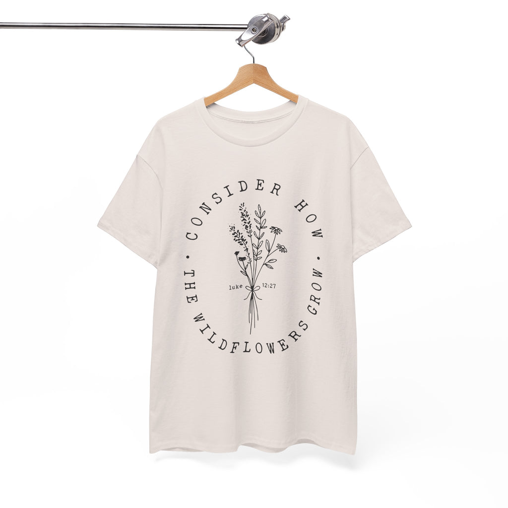 Front view Ice Grey t-shirt with large black floral graphic and Luke 12:27 Bible verse displayed on a hanger