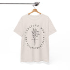 Front view Ice Grey t-shirt with large black floral graphic and Luke 12:27 Bible verse displayed on a hanger