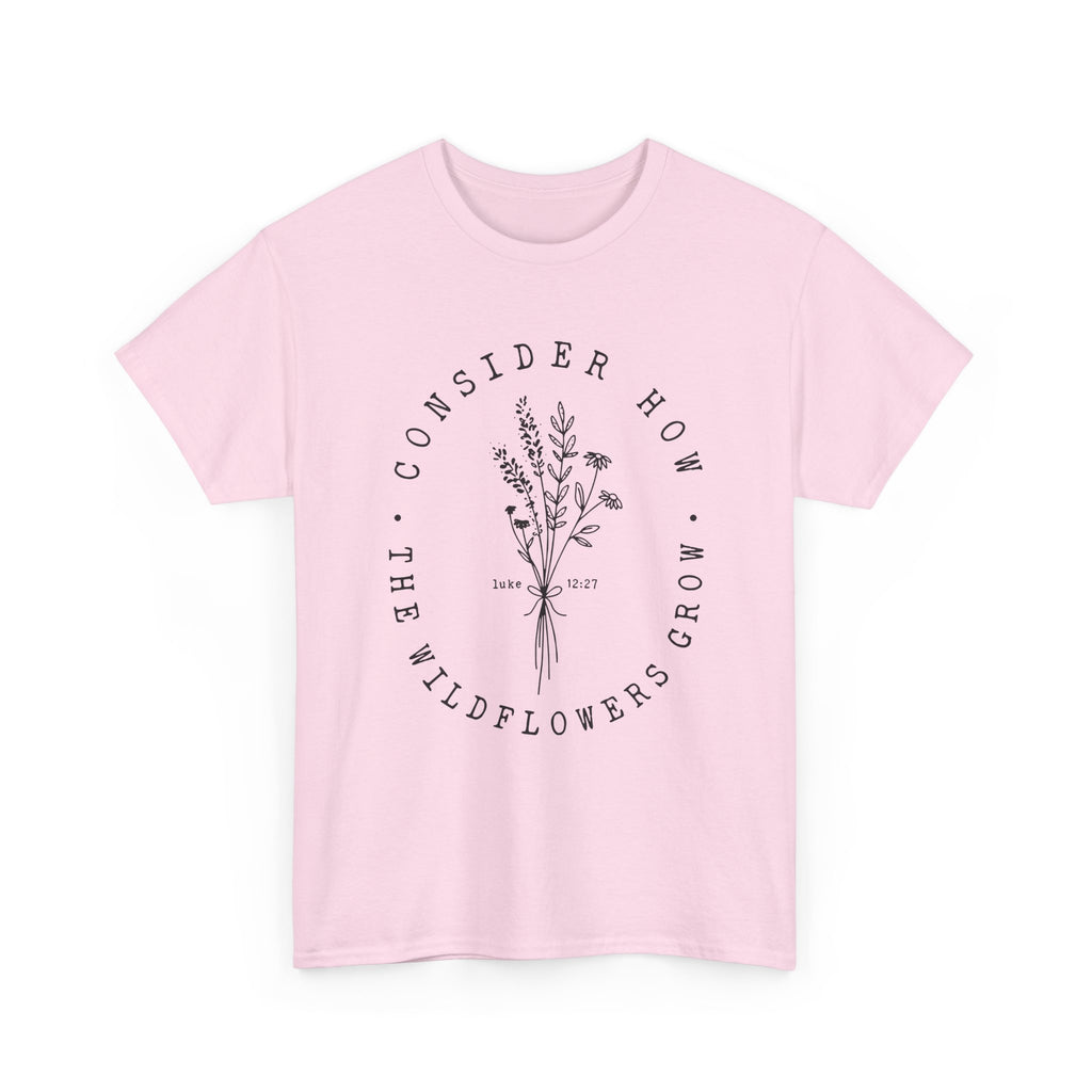 Front view Light Pink t-shirt with large black floral graphic and Luke 12:27 Bible verse 