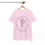 Front view Light Pink t-shirt with large black floral graphic and Luke 12:27 Bible verse displayed on a hanger