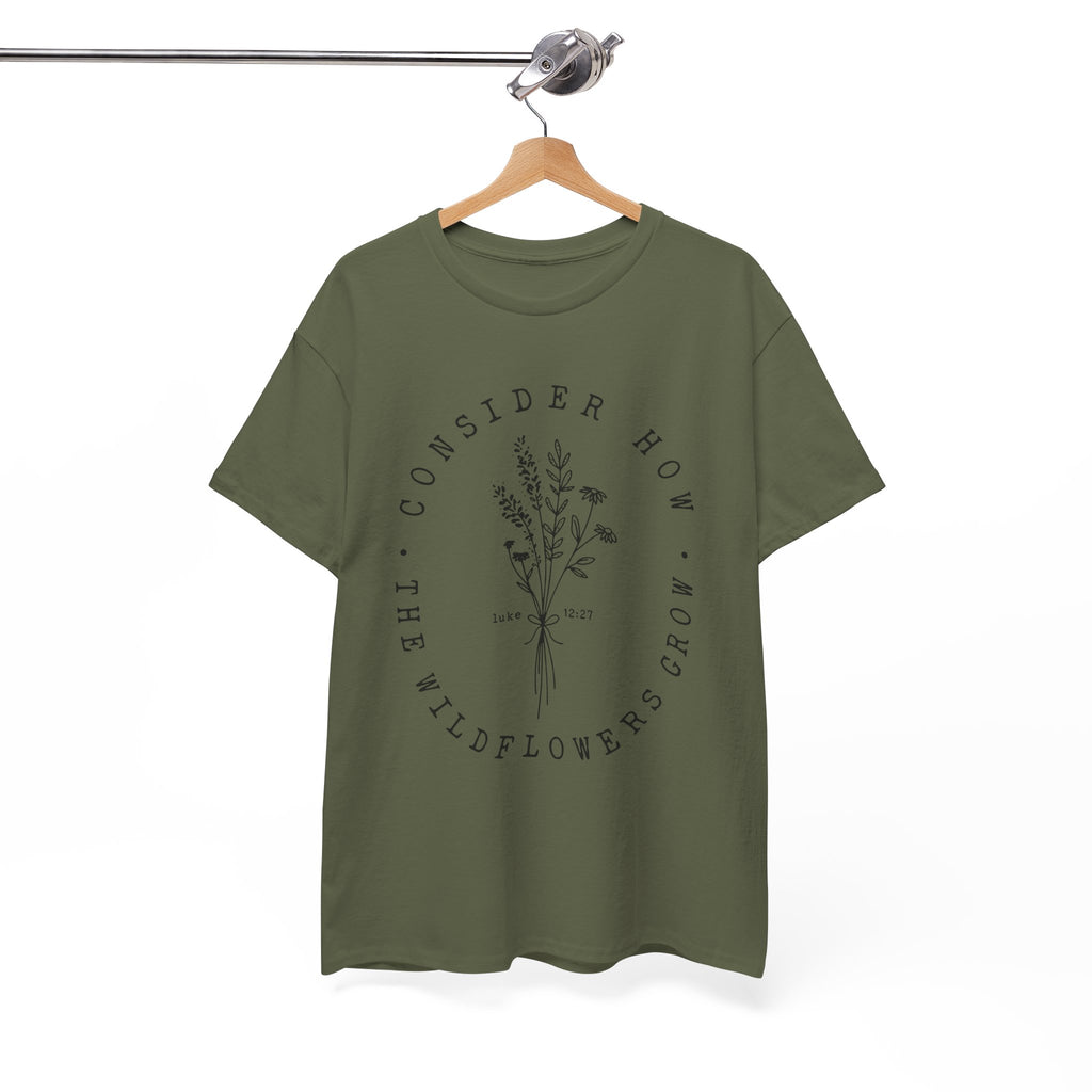 Front view Military Green t-shirt with large black floral graphic and Luke 12:27 Bible verse displayed on a hanger