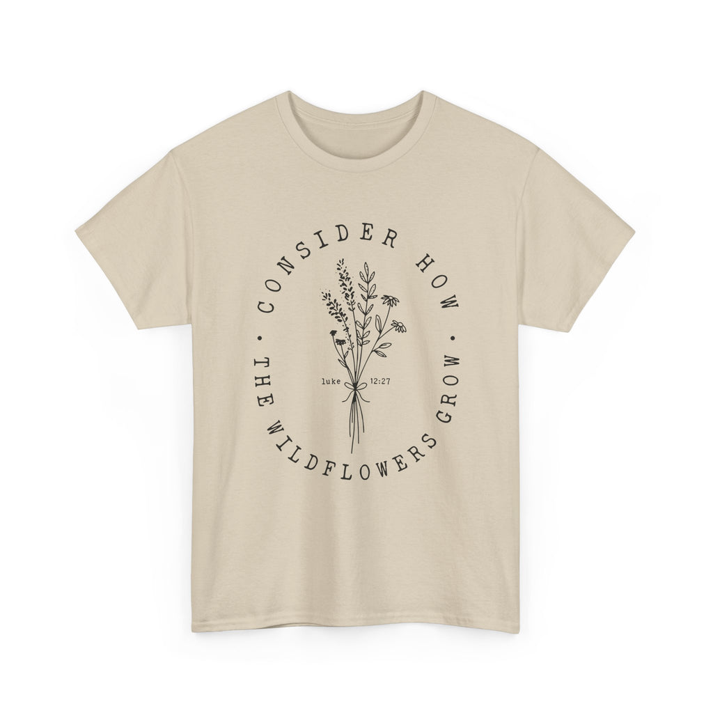 Front view Sand t-shirt with large black floral graphic and Luke 12:27 Bible verse 