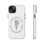 White iPhone case with black floral graphic and Luke 12:27 Bible verse displayed on an iPhone 14 Plus