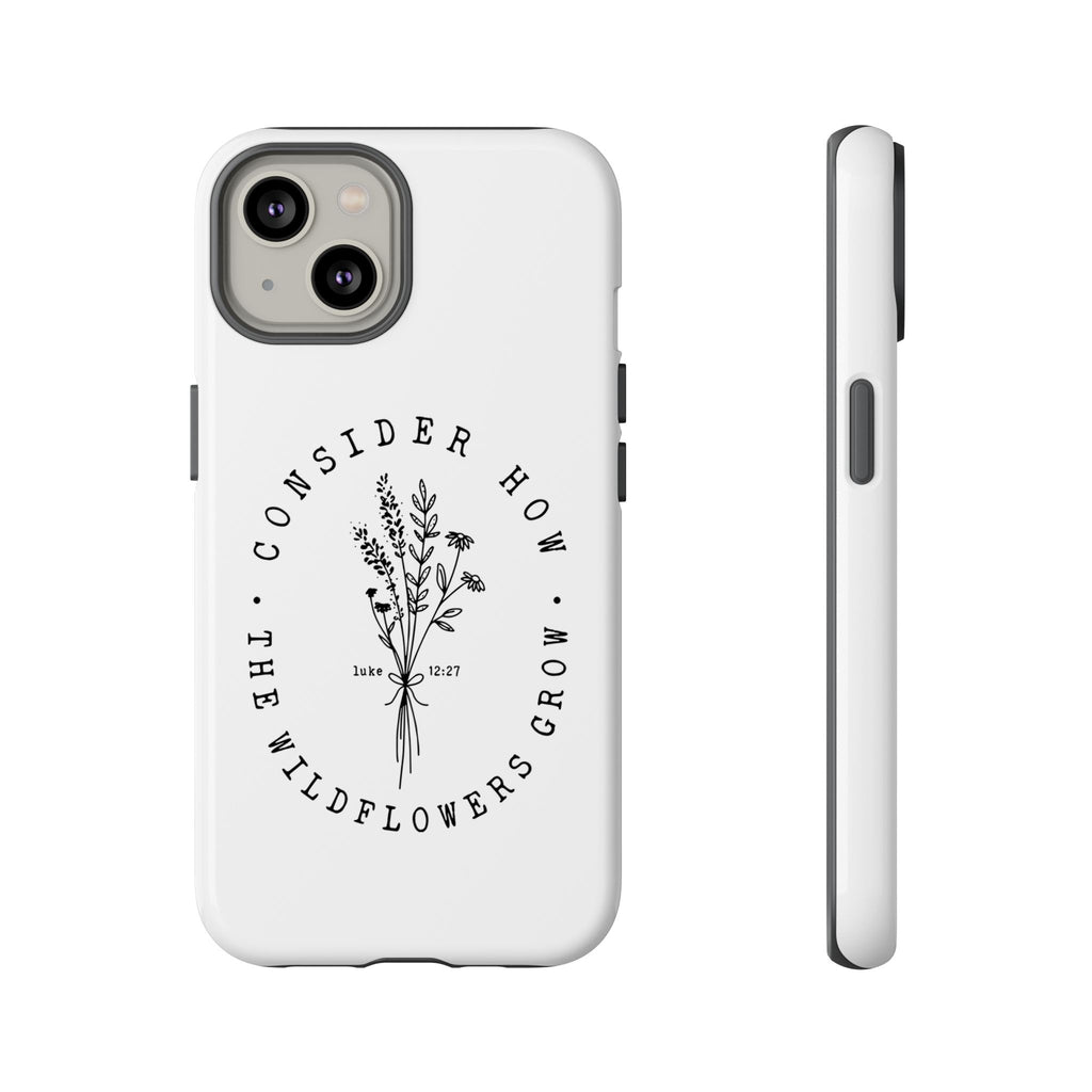 White iPhone case with black floral graphic and Luke 12:27 Bible verse displayed on an iPhone 14