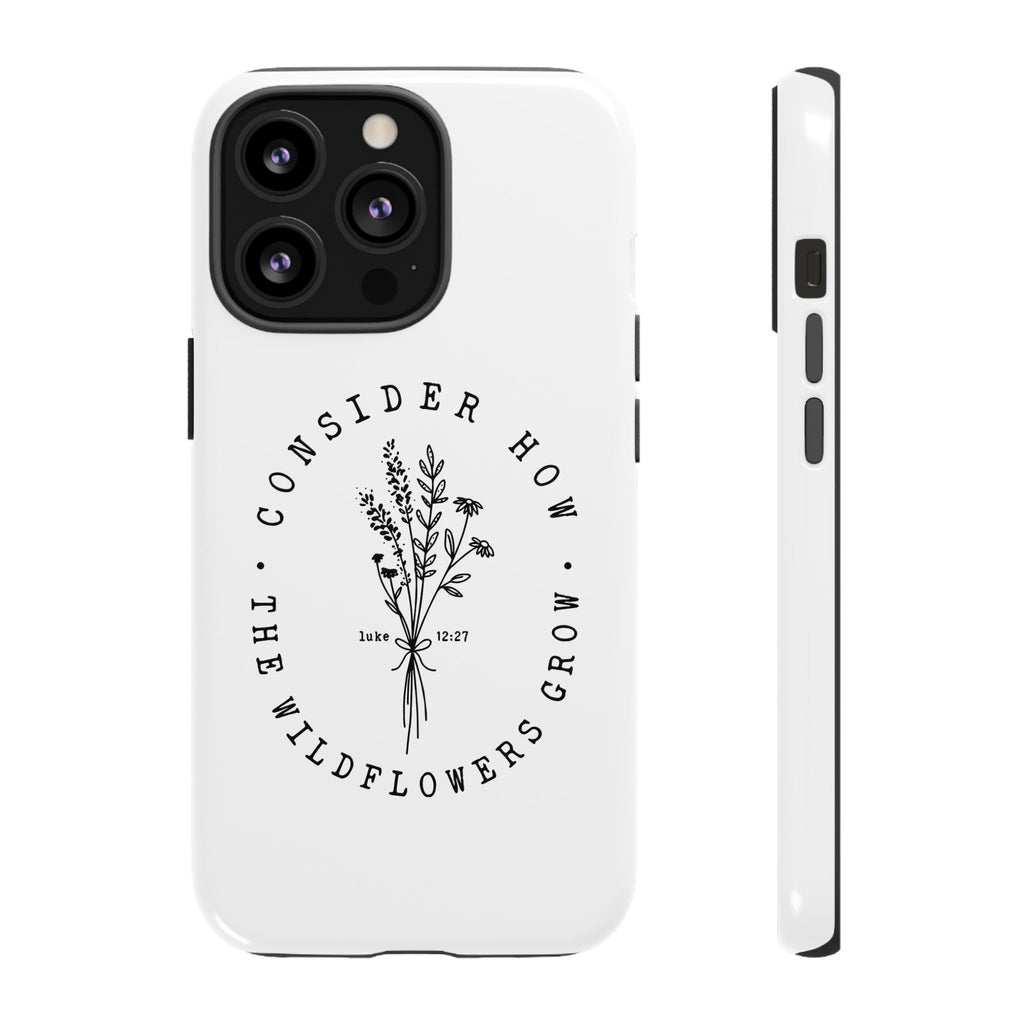 White iPhone case with black floral graphic and Luke 12:27 Bible verse displayed on an iPhone 13 Pro