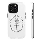 White iPhone case with black floral graphic and Luke 12:27 Bible verse displayed on an iPhone 13 Pro