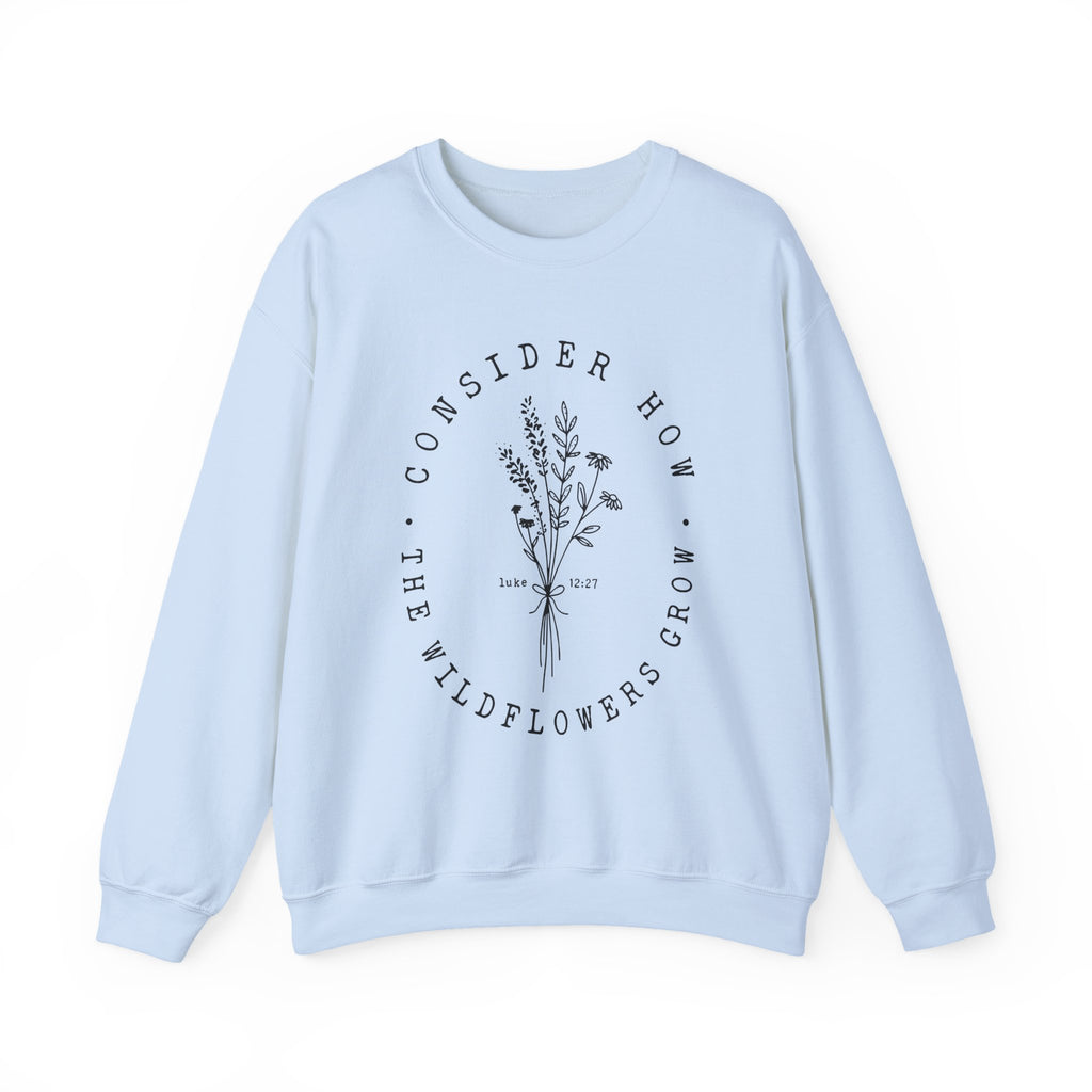 Front view Light Blue crewneck sweatshirt black floral graphic and 'Consider How the Wildflowers Grow' text from Bible verse Luke 12:27