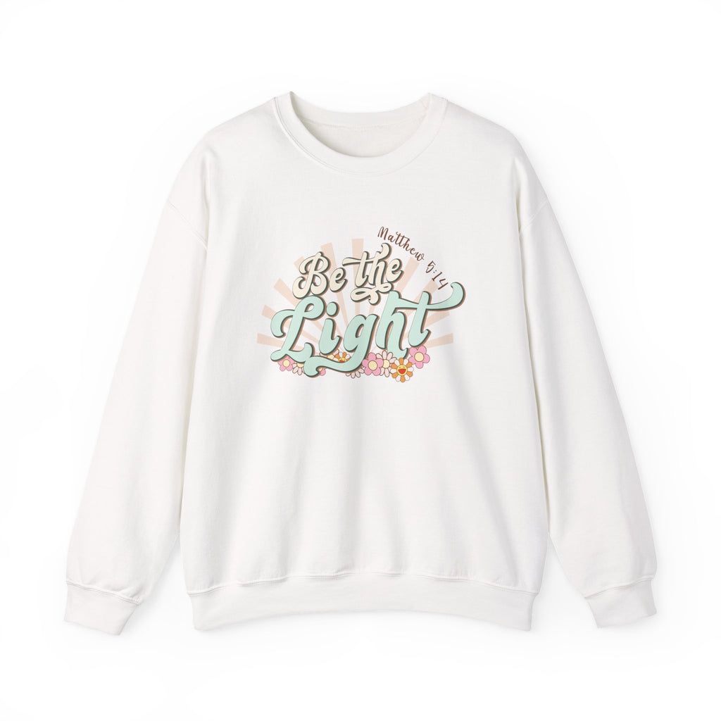 Front view White crewneck sweatshirt colorful graphic and text saying ‘Be the Light’ 