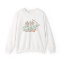 Front view White crewneck sweatshirt colorful graphic and text saying ‘Be the Light’ 