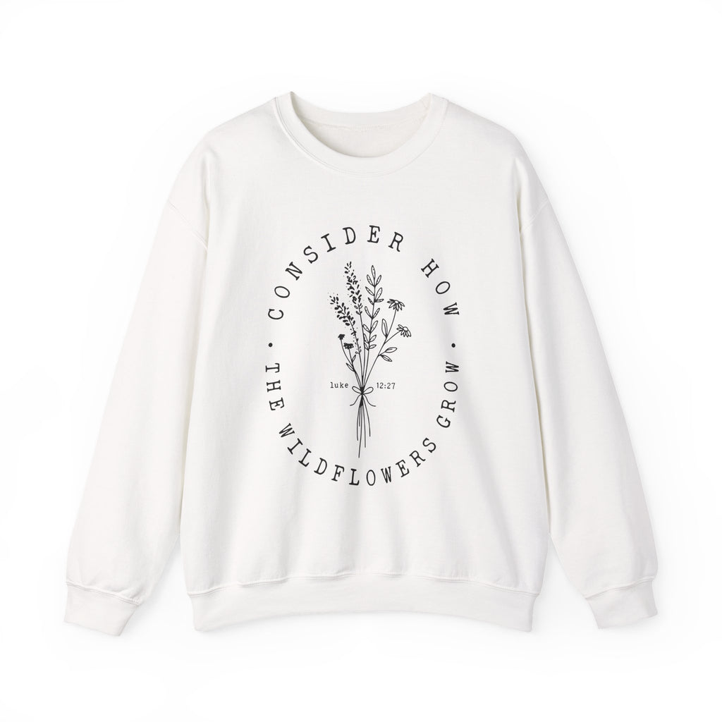 Front view White crewneck sweatshirt black floral graphic and 'Consider How the Wildflowers Grow' text from Bible verse Luke 12:27