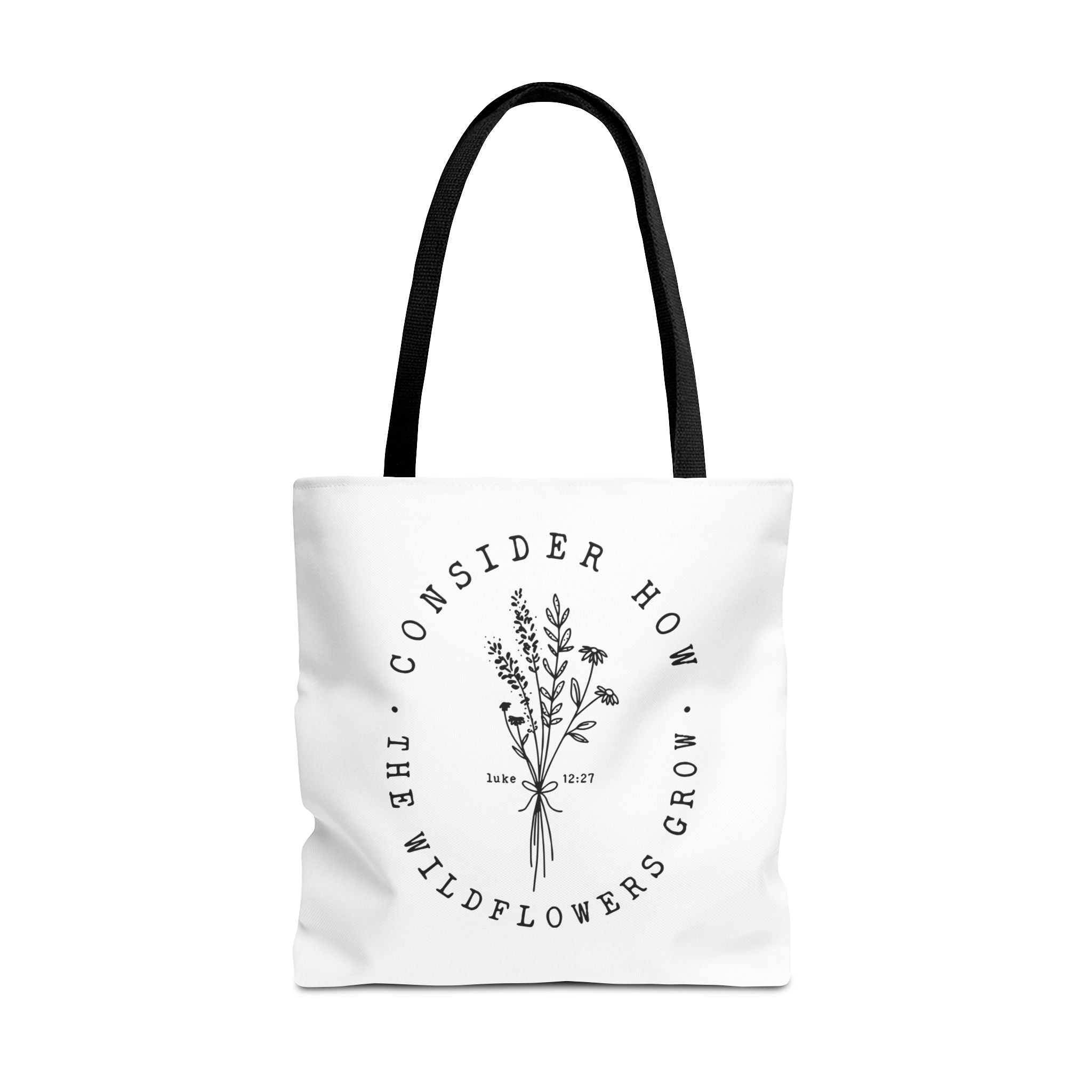 Front view of large White tote bag with black handles and large black floral graphic and Luke 12:27 Bible verse