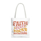 Front view of large White tote bag with white handles and colorful graphic that says Faith Can Move Mountains