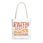 Front view of medium White tote bag with white handles and colorful graphic that says Faith Can Move Mountains