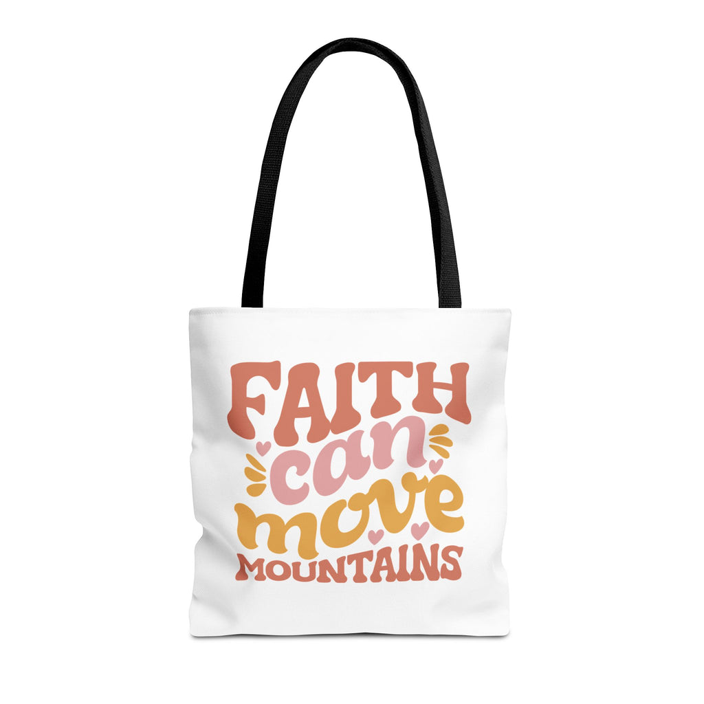 Front view of medium White tote bag with black handles and colorful graphic that says Faith Can Move Mountains