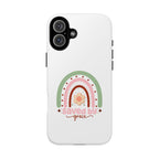 White iPhone case with rainbow graphic saying Saved by Grace displayed on an iPhone 16 Plus