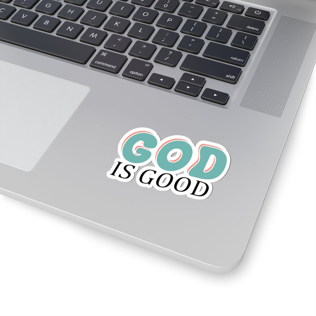 Retro-style sticker with colorful text saying God Is Good. Displayed on laptop.