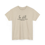 Front view of Sand t-shirt with black text Be Still And Know That I Am God Psalm 46:10 centered on chest