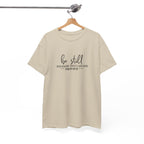 Front view of Sand t-shirt with black text Be Still And Know That I Am God Psalm 46:10 centered on chest. Shirt is displayed on a hanger.
