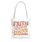 Front view of small White tote bag with white handles and colorful graphic that says Faith Can Move Mountains