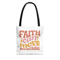 Front view of small White tote bag with black handles and colorful graphic that says Faith Can Move Mountains