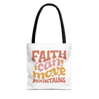 Front view of small White tote bag with black handles and colorful graphic that says Faith Can Move Mountains