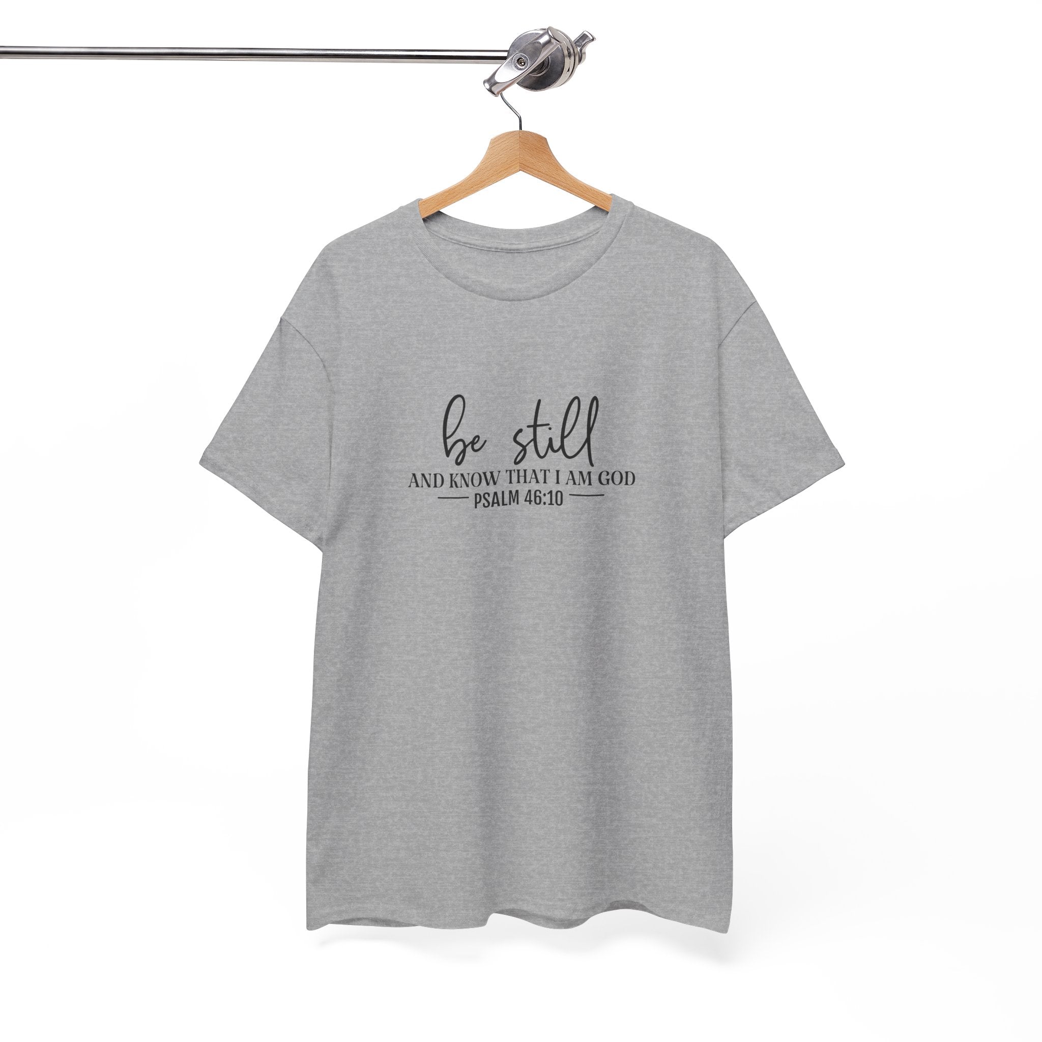 Front view of Sport Grey t-shirt with black text Be Still And Know That I Am God Psalm 46:10 centered on chest. Shirt is displayed on a hanger.