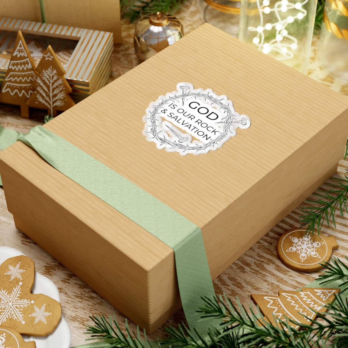 Sticker with black graphic and text saying God Is Our Rock & Salvation. Displayed on gift box.