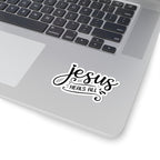 Sticker with black text saying Jesus Heals All. Displayed on laptop.