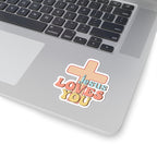 Sticker with colorful graphic and text saying Jesus Loves You. Displayed on laptop.