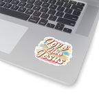 Sticker with colorful graphic and text saying Love Like Jesus. Displayed on laptop.