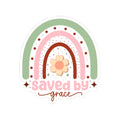Sticker with pastel colored rainbow graphic with the text Saved by Grace