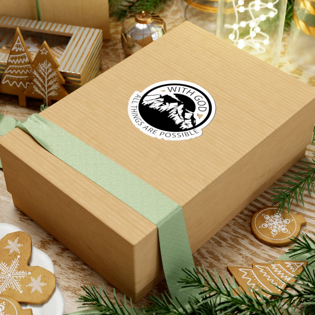 Sticker with black graphic and text saying With God All Things Are Possible. Displayed on gift box.