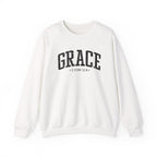 Front view of White crewneck sweatshirt with black large GRACE text and 2 COR 12:9 below it across chest