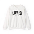 Front view of White crewneck sweatshirt with black large LOVED text and John 3:16 below it across chest