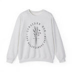 Front view Ash crewneck sweatshirt black floral graphic and 'Consider How the Wildflowers Grow' text from Bible verse Luke 12:27